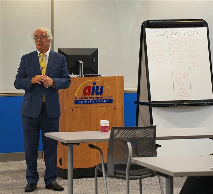 Robert Reed, executive deputy attorney general for special initiatives at the Pennsylvania Office of the Attorney General, stands in front of the crowd at the AIU's Handle with Care event